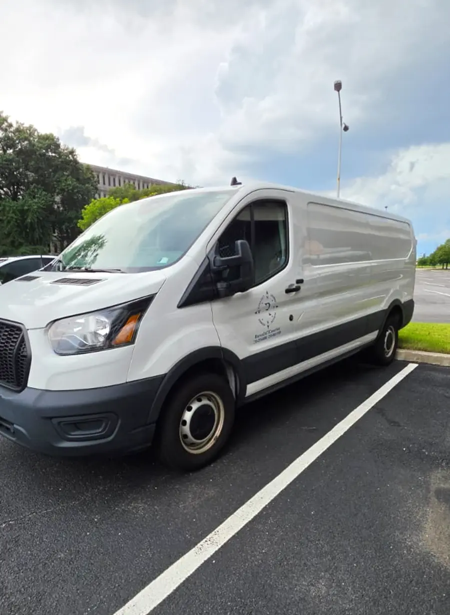Side profile of a long-wheelbase Rush 24/7 Ford Transit cargo van