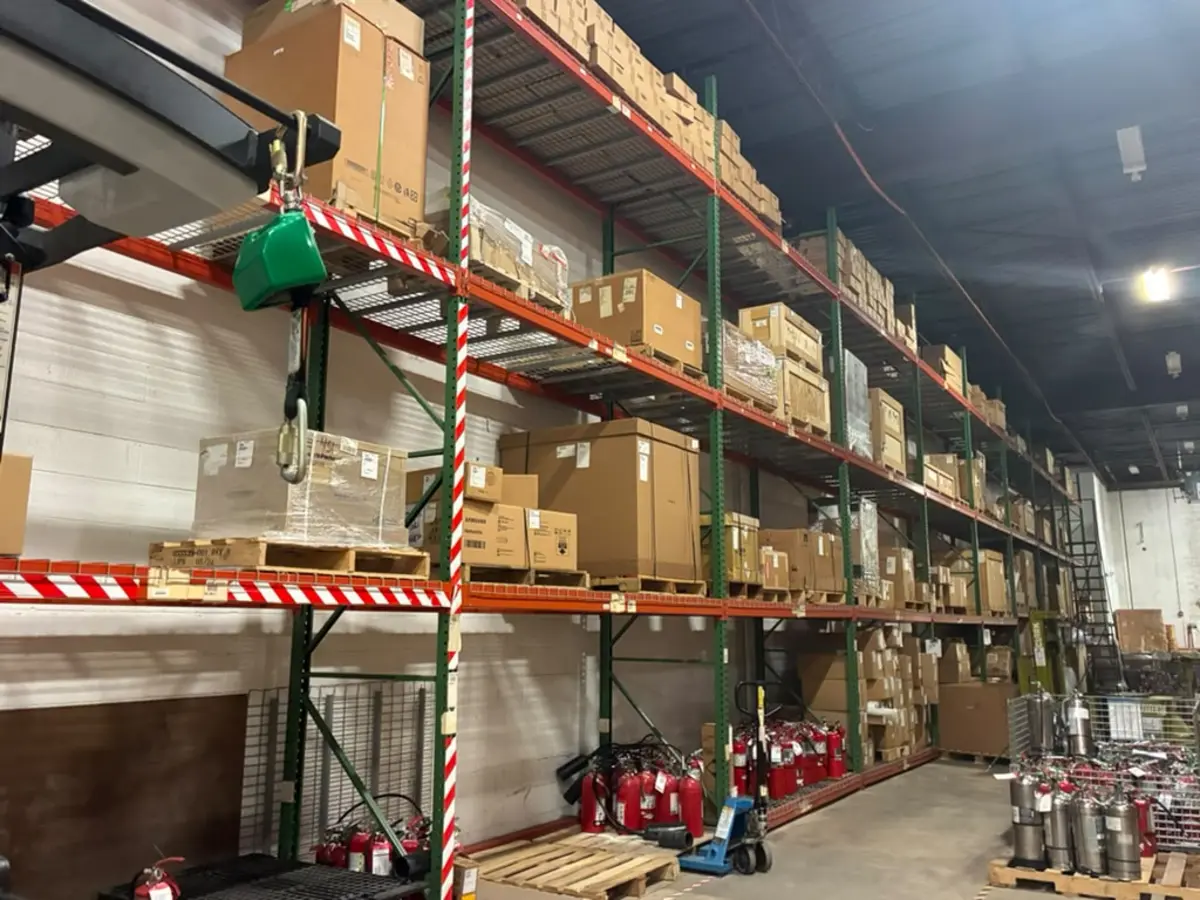 Racked warehouse bays with palletized freight at Rush 24/7 Courier